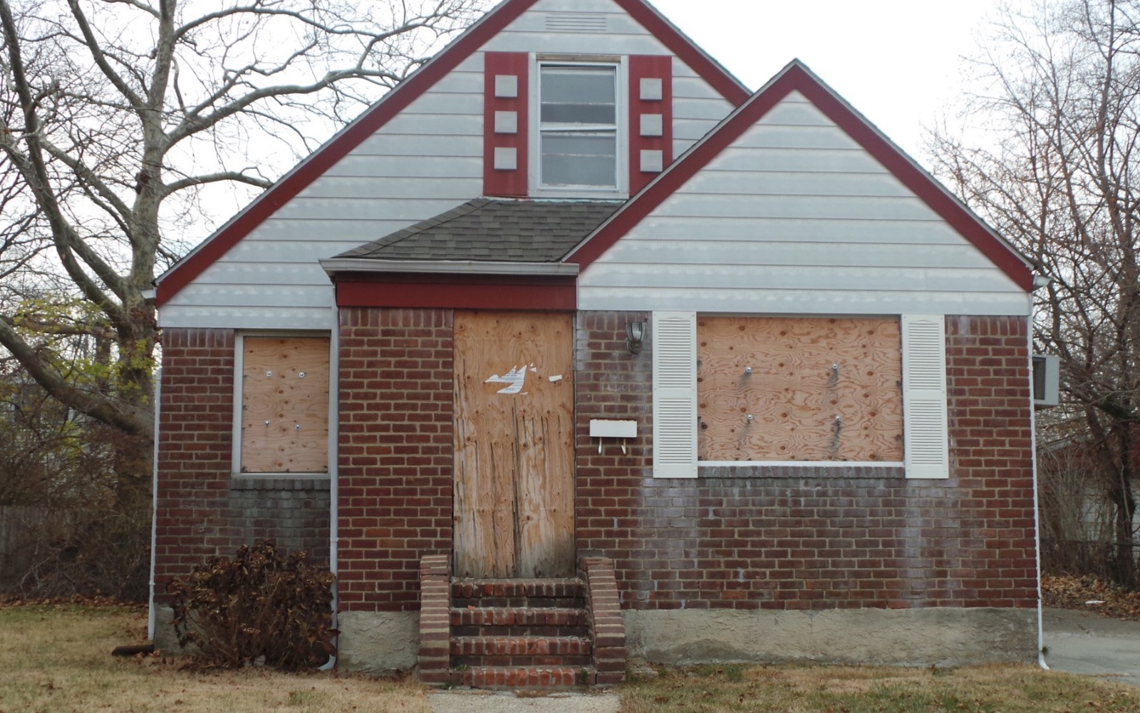 Boarded Winston-Salem style home that may fit an as-is sale
